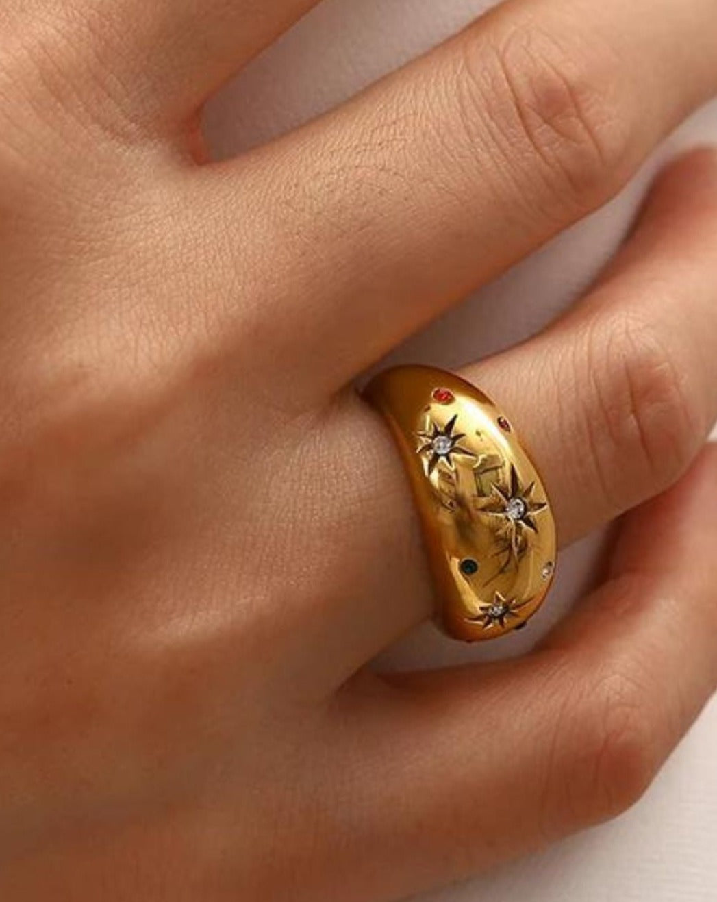 **Title:** "Axie Charm Ring"

**Description:** Meet Sofia, the embodiment of elegance; this Axie Charm Ring captures her vibrant spirit with a playful design that shines in any setting.