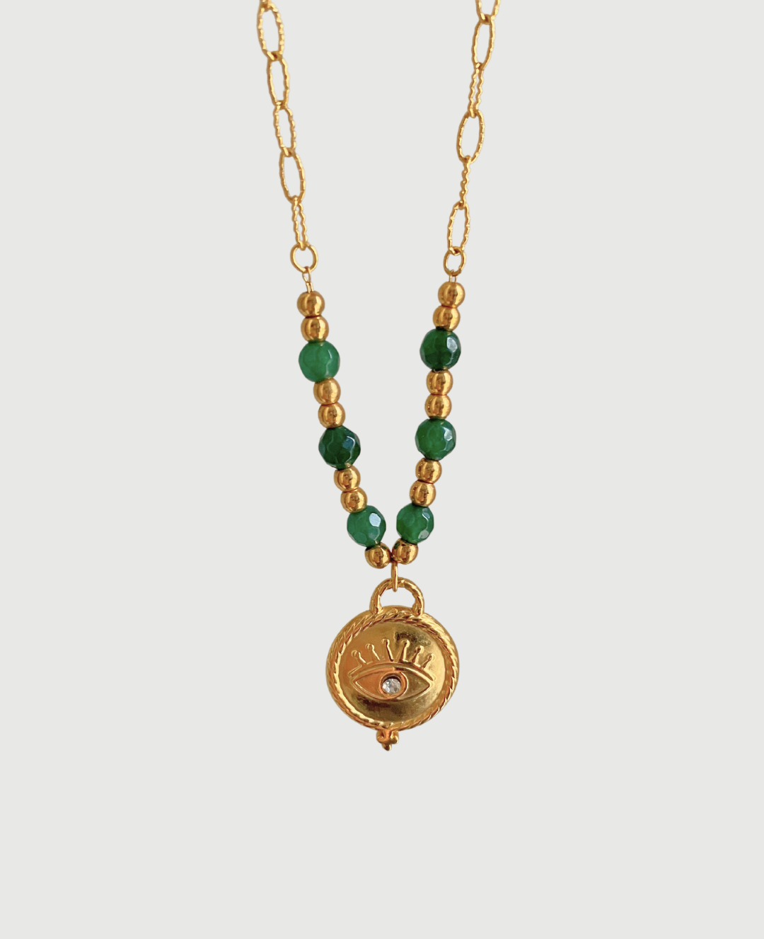 Adorn yourself like Sophia with this stunning emerald bead necklace that adds a touch of elegance to any outfit."  

**Jade Gem Necklace**  
"Channel your inner Mia with this exquisite jade gem necklace, perfect for making a bold statement."  

**Green Pe