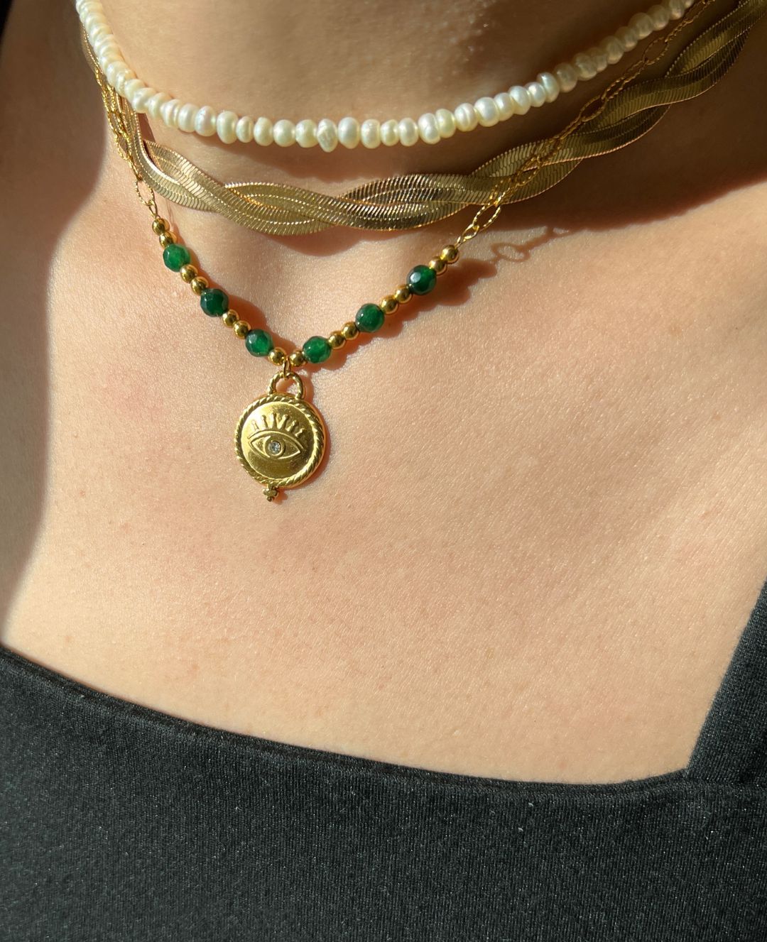 Adorn yourself like Sophia with this stunning emerald bead necklace that adds a touch of elegance to any outfit."  

**Jade Gem Necklace**  
"Channel your inner Mia with this exquisite jade gem necklace, perfect for making a bold statement."  

**Green Pe