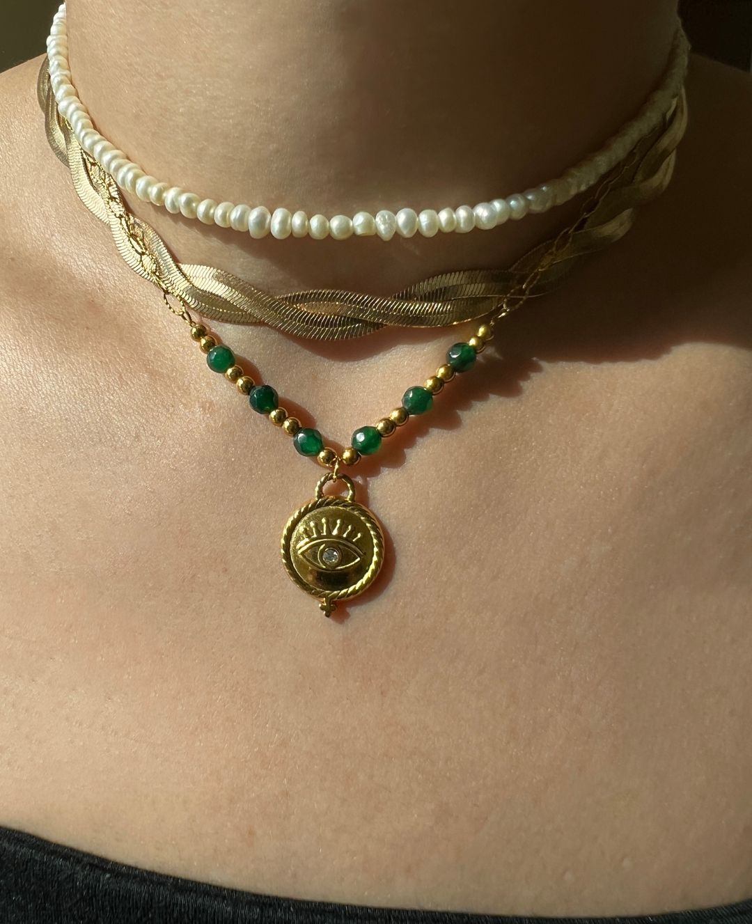 Adorn yourself like Sophia with this stunning emerald bead necklace that adds a touch of elegance to any outfit."  

**Jade Gem Necklace**  
"Channel your inner Mia with this exquisite jade gem necklace, perfect for making a bold statement."  

**Green Pe