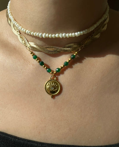 Adorn yourself like Sophia with this stunning emerald bead necklace that adds a touch of elegance to any outfit."  

**Jade Gem Necklace**  
"Channel your inner Mia with this exquisite jade gem necklace, perfect for making a bold statement."  

**Green Pe