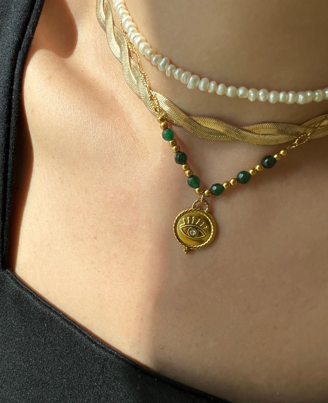 Adorn yourself like Sophia with this stunning emerald bead necklace that adds a touch of elegance to any outfit."  

**Jade Gem Necklace**  
"Channel your inner Mia with this exquisite jade gem necklace, perfect for making a bold statement."  

**Green Pe
