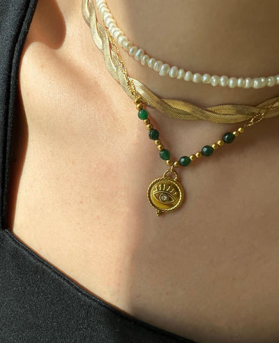 Adorn yourself like Sophia with this stunning emerald bead necklace that adds a touch of elegance to any outfit."  

**Jade Gem Necklace**  
"Channel your inner Mia with this exquisite jade gem necklace, perfect for making a bold statement."  

**Green Pe
