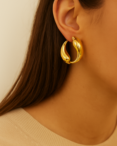 **Title:** "Iris Elegance Earrings"  
**Description:** Adorn your ears with the stunning Iris earrings, a perfect blend of grace and charm. Designed for the modern woman who loves to shine.  

**Title:** "Bella Chic Hoops"  
**Description:** Elevate your