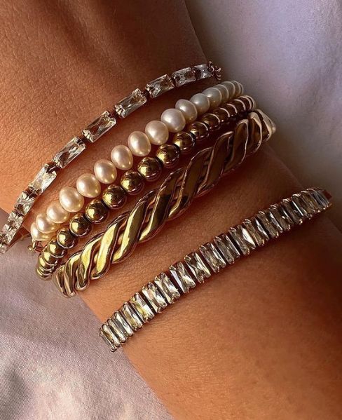 **Celia's Charm Bracelet**  
Elevate your style with Celia's Charm Bracelet, a stunning accessory that adds a touch of elegance to any outfit.  

**Maya's Gemstone Bangle**  
Discover Maya's Gemstone Bangle, a vibrant blend of colors that brings joy and p
