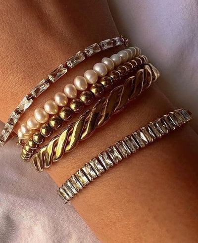 **Celia's Charm Bracelet**  
Elevate your style with Celia's Charm Bracelet, a stunning accessory that adds a touch of elegance to any outfit.  

**Maya's Gemstone Bangle**  
Discover Maya's Gemstone Bangle, a vibrant blend of colors that brings joy and p