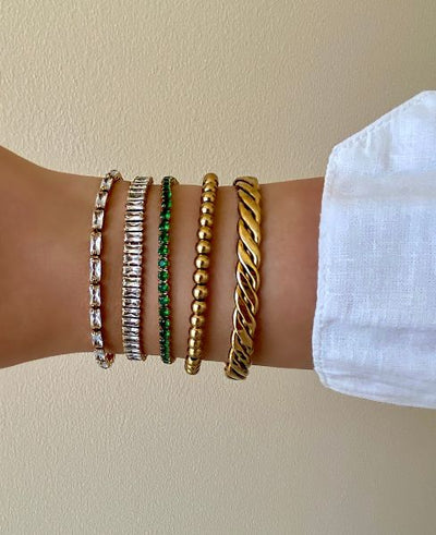 **Celia's Charm Bracelet**  
Elevate your style with Celia's Charm Bracelet, a stunning accessory that adds a touch of elegance to any outfit.  

**Maya's Gemstone Bangle**  
Discover Maya's Gemstone Bangle, a vibrant blend of colors that brings joy and p